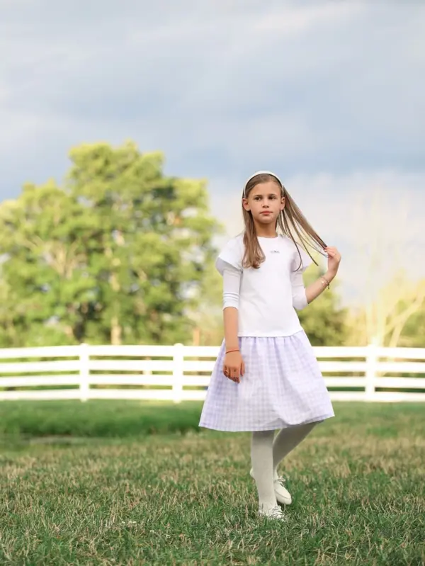 Girl in a white dress walking by a white fence, outdoor photography by Photoholic, Rockland County NY